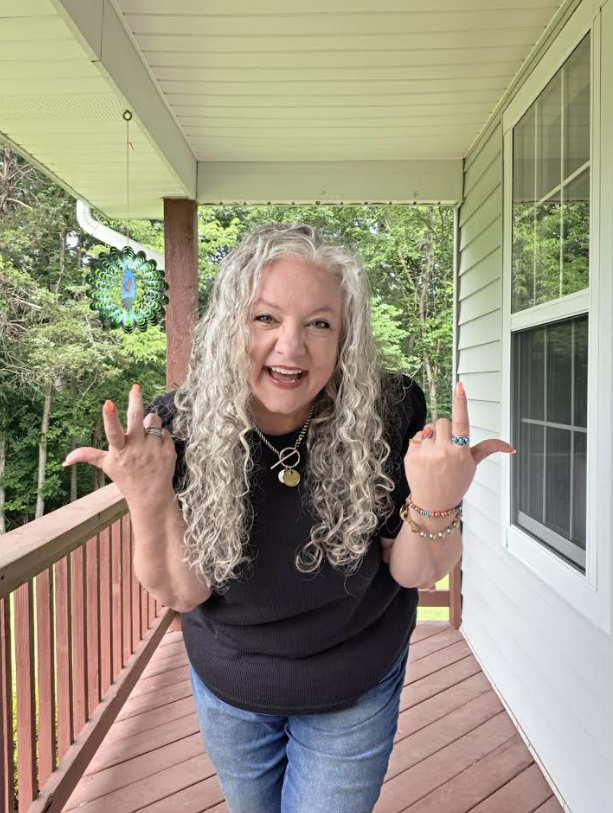 Christy standing on a porch, representing her weight loss and wellness journey with confidence